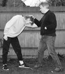 A person holding another person's head

Description automatically generated with low confidence