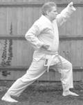 A person in a karate uniform

Description automatically generated with medium confidence