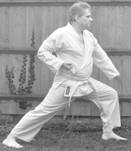 A person in a karate uniform

Description automatically generated with medium confidence