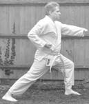 A person in a karate uniform

Description automatically generated with medium confidence