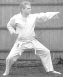 A person in a karate uniform

Description automatically generated with medium confidence
