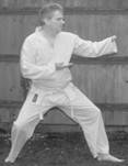 A person in a karate uniform

Description automatically generated with medium confidence