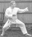 A person in a karate uniform

Description automatically generated with medium confidence
