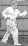 A person in a karate uniform

Description automatically generated with medium confidence
