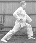 A person in a karate uniform

Description automatically generated with medium confidence