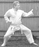 A person in a karate uniform

Description automatically generated with medium confidence