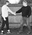 A person shaking hands with another person

Description automatically generated with medium confidence