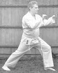 A person in a karate uniform

Description automatically generated with medium confidence