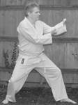 A person in a karate uniform

Description automatically generated with medium confidence