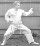 A person in a karate uniform

Description automatically generated with low confidence