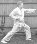A person in a karate uniform

Description automatically generated with medium confidence