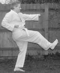 A person in a karate uniform

Description automatically generated with low confidence